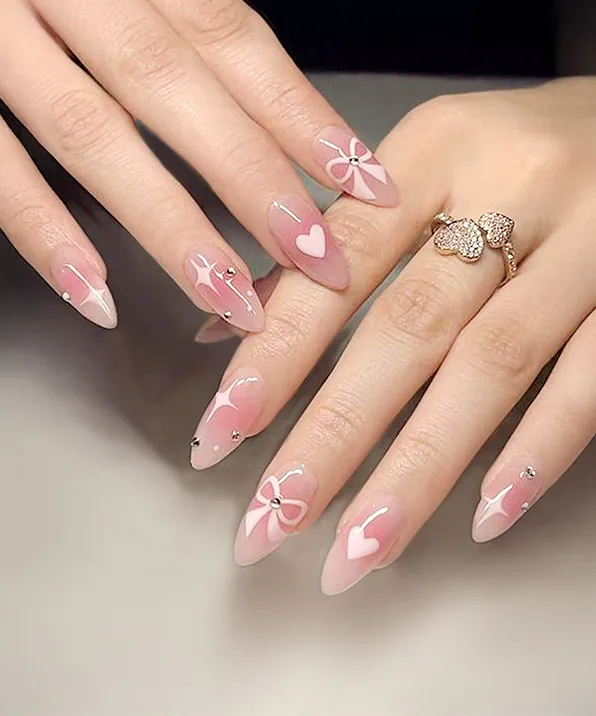 Bows and hearts: Soft pink almond with hand-painted bows, done at Enchanted
