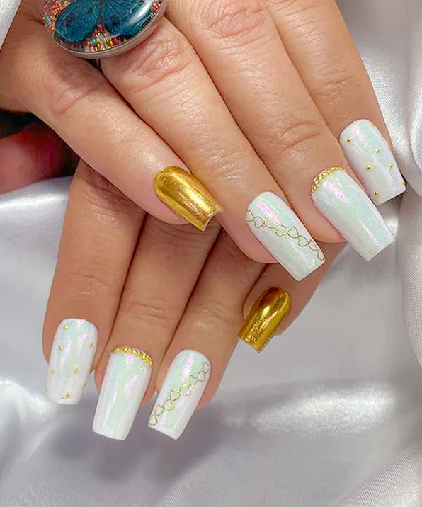 Gold chrome and pearl: Mirror gold accents with pearl white squares, done at Enchanted